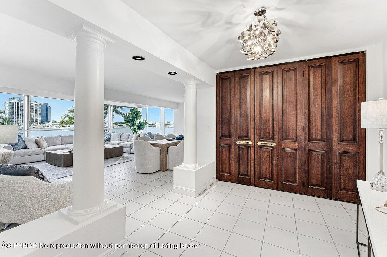 44 Cocoanut Row, Unit 120B Palm Beach, FL 33480 - Photo 3 of 42 a view of an entryway with a chandelier