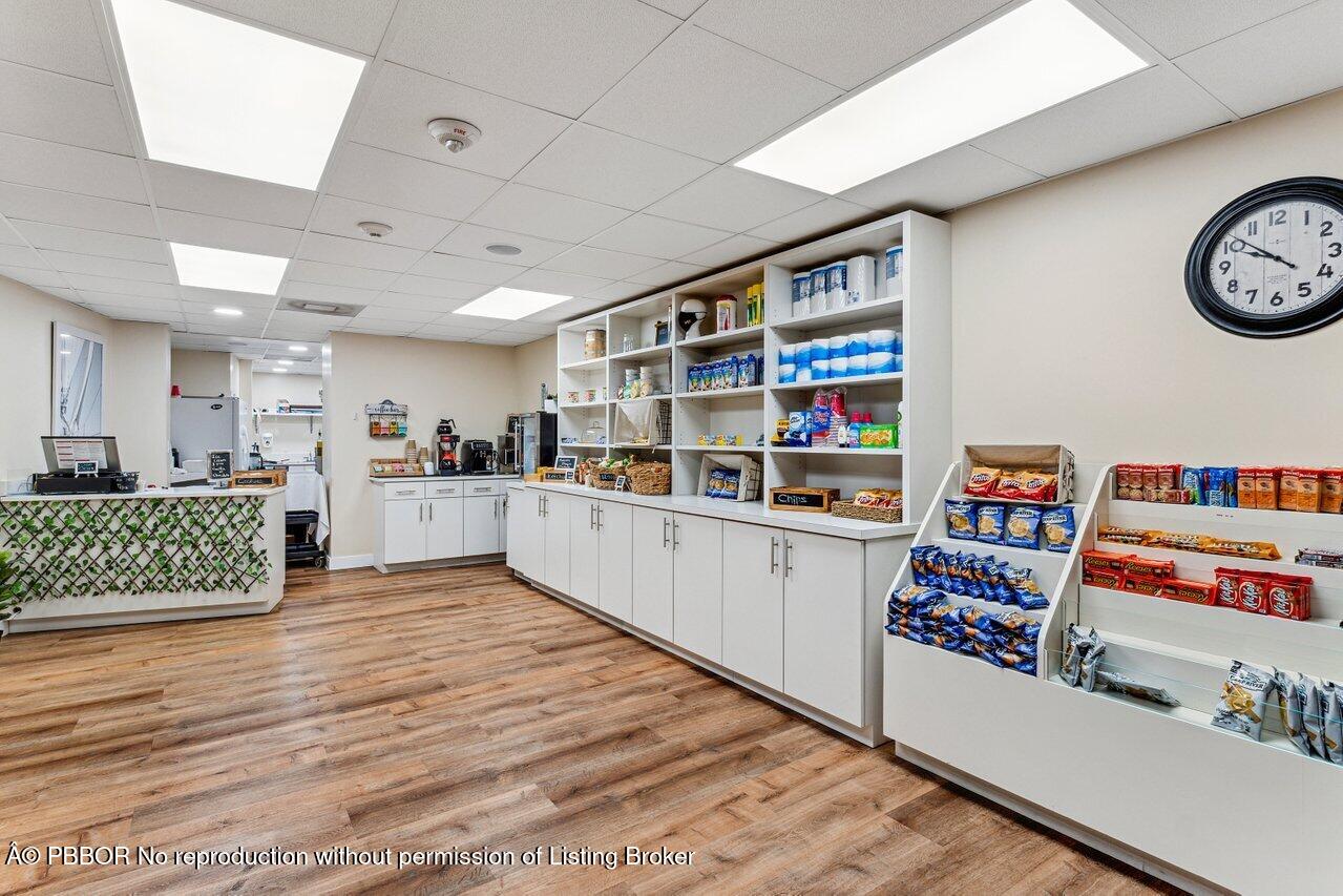 44 Cocoanut Row, Unit 120B Palm Beach, FL 33480 - Photo 37 of 42 a living room with hard wood flooring and a couch
