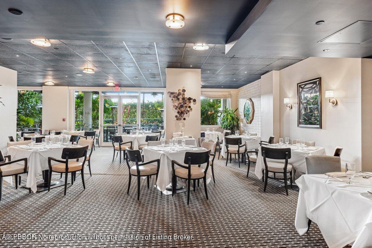 44 Cocoanut Row, Unit 120B Palm Beach, FL 33480 - Photo 38 of 42 a view of a dining room with furniture window and outside view