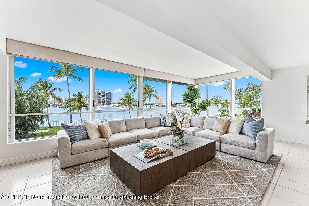 44 Cocoanut Row, Unit 120B Palm Beach, FL 33480 - Photo 5 of 42 a living room with furniture potted plant and a large window