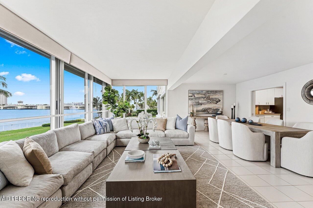 44 Cocoanut Row, Unit 120B Palm Beach, FL 33480 - Photo 6 of 42 a living room with furniture and a large window