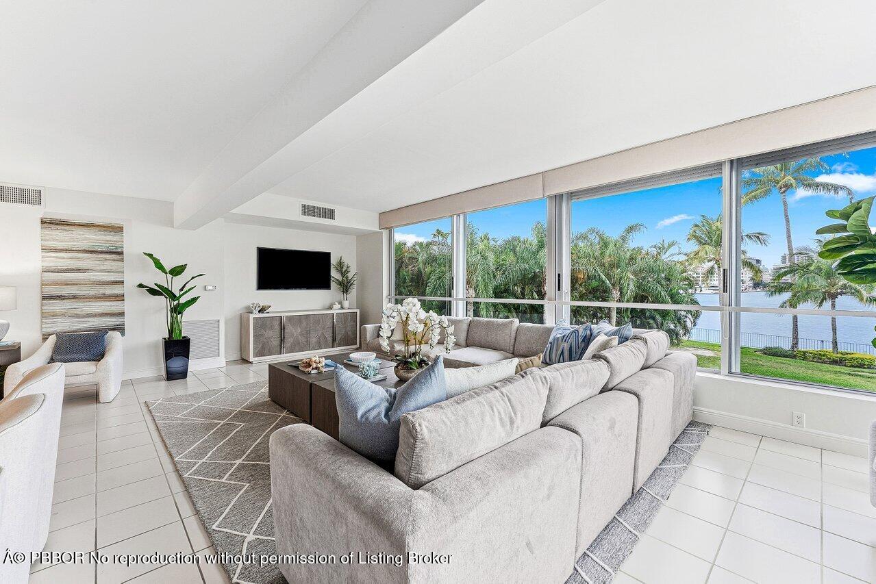 44 Cocoanut Row, Unit 120B Palm Beach, FL 33480 - Photo 10 of 42 a living room with furniture and a flat screen tv