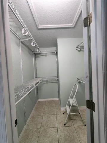 a view of a storage & utility room with dryer and washer
