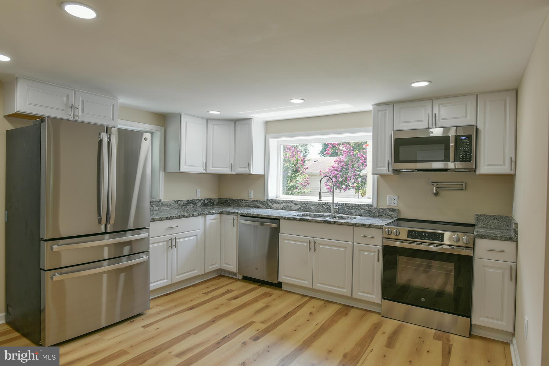 70 Nottingham Road Hagerstown, MD 21740 - Photo 11 of 39 a kitchen with granite countertop stainless steel appliances a sink cabinets and a window