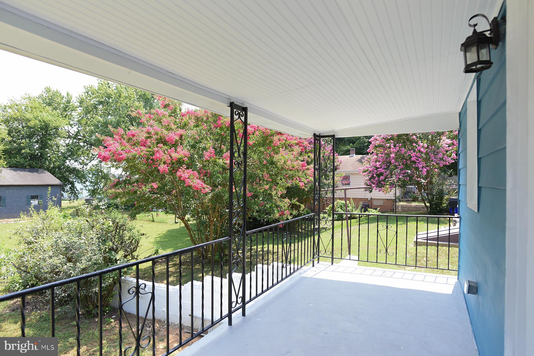 70 Nottingham Road Hagerstown, MD 21740 - Photo 14 of 39 a view of a porch and a bench