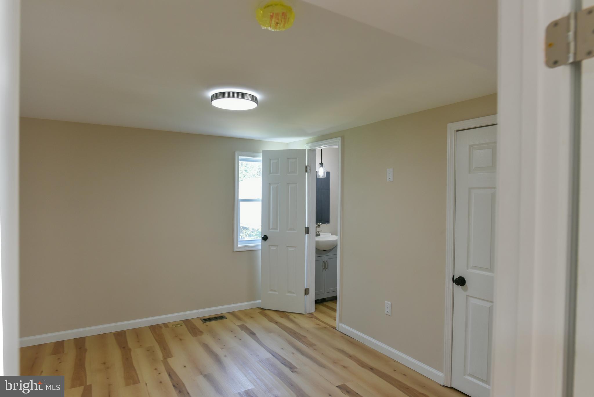70 Nottingham Road Hagerstown, MD 21740 - Photo 15 of 39 a view of an empty room with wooden floor and a window