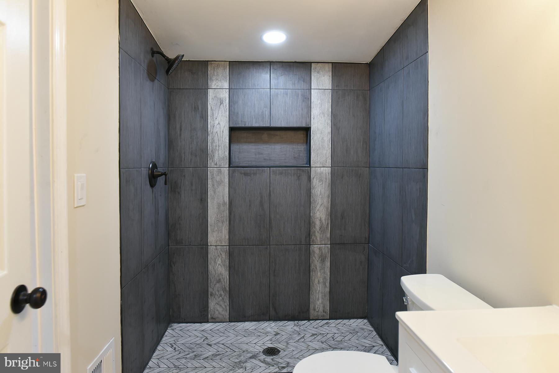 70 Nottingham Road Hagerstown, MD 21740 - Photo 26 of 39 a bathroom with a shower and toilet