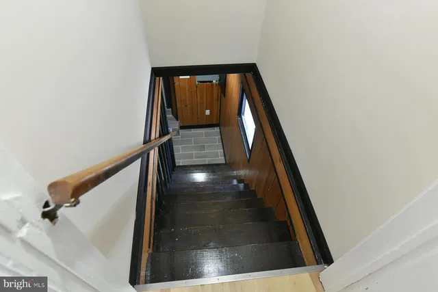 an entrance door view with staircase