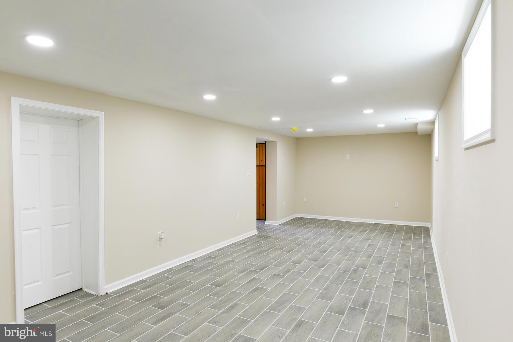 70 Nottingham Road Hagerstown, MD 21740 - Photo 37 of 39 an empty room with wooden floor and natural light