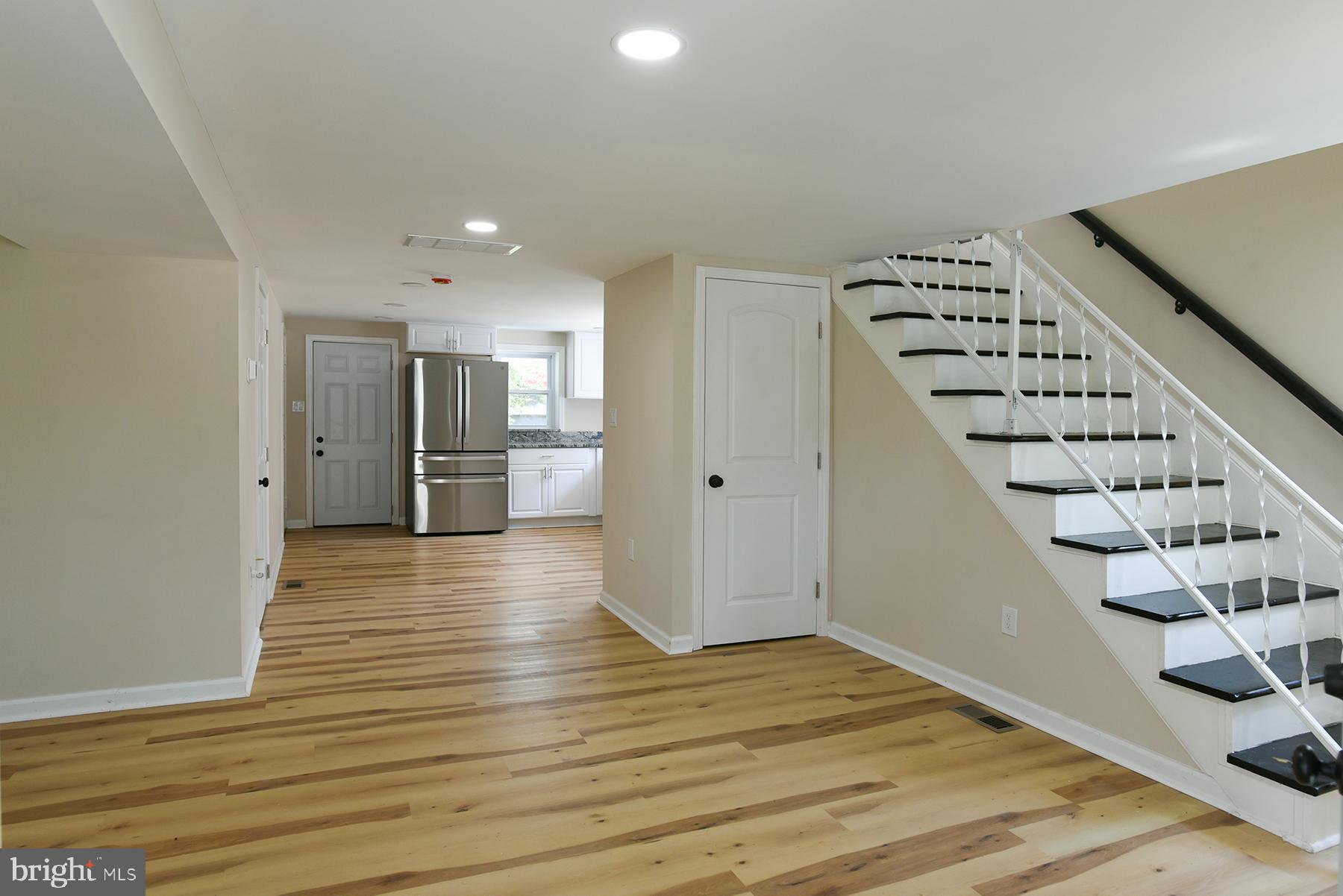 70 Nottingham Road Hagerstown, MD 21740 - Photo 7 of 39 a view of an empty room with wooden floor and entryway