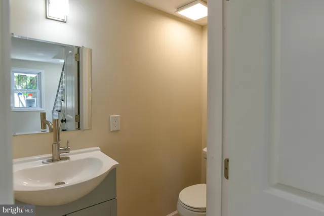 a view of entryway with wooden floor and stairs