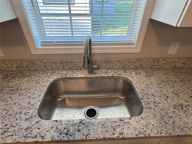 a bathroom with a sink and mirror