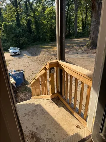 a view of deck with two chairs and a table