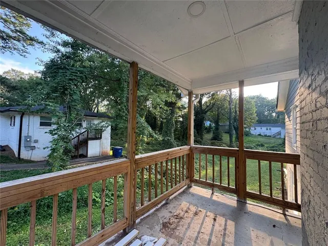 a view of a city street from a balcony