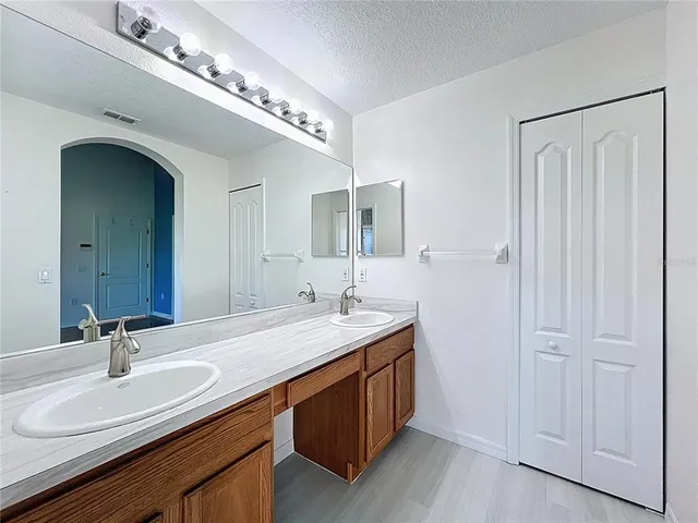 a utility room with sink dryer and washer