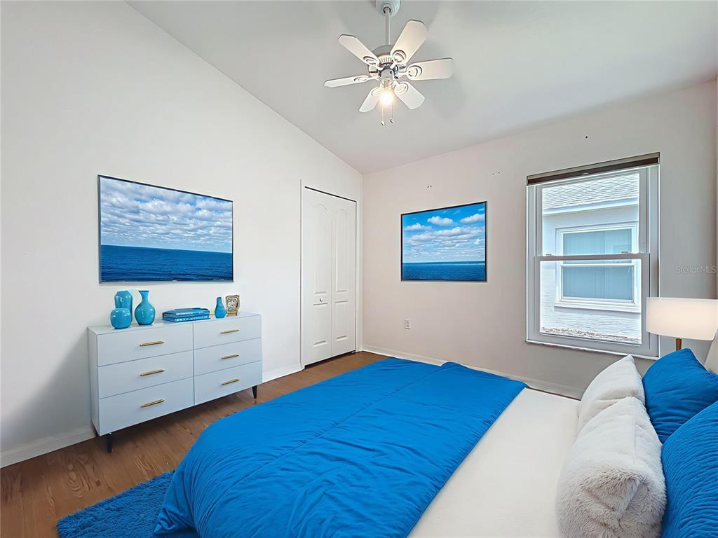 11644 Spindrift Loop Hudson, FL 34667 - Photo 35 of 99 a bedroom with a bed and a window