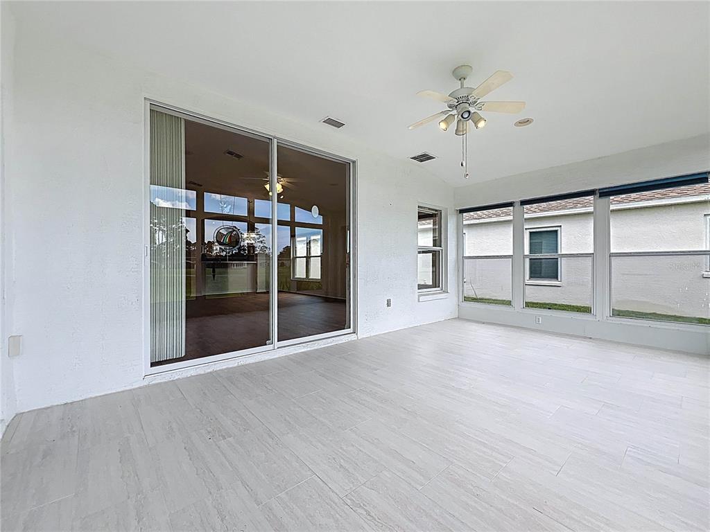 11644 Spindrift Loop Hudson, FL 34667 - Photo 48 of 99 a view of a livingroom with wooden floor and chandelier