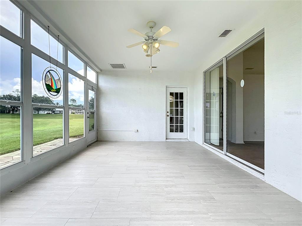 11644 Spindrift Loop Hudson, FL 34667 - Photo 51 of 99 a view of an entryway with a floor to ceiling window and an entrance