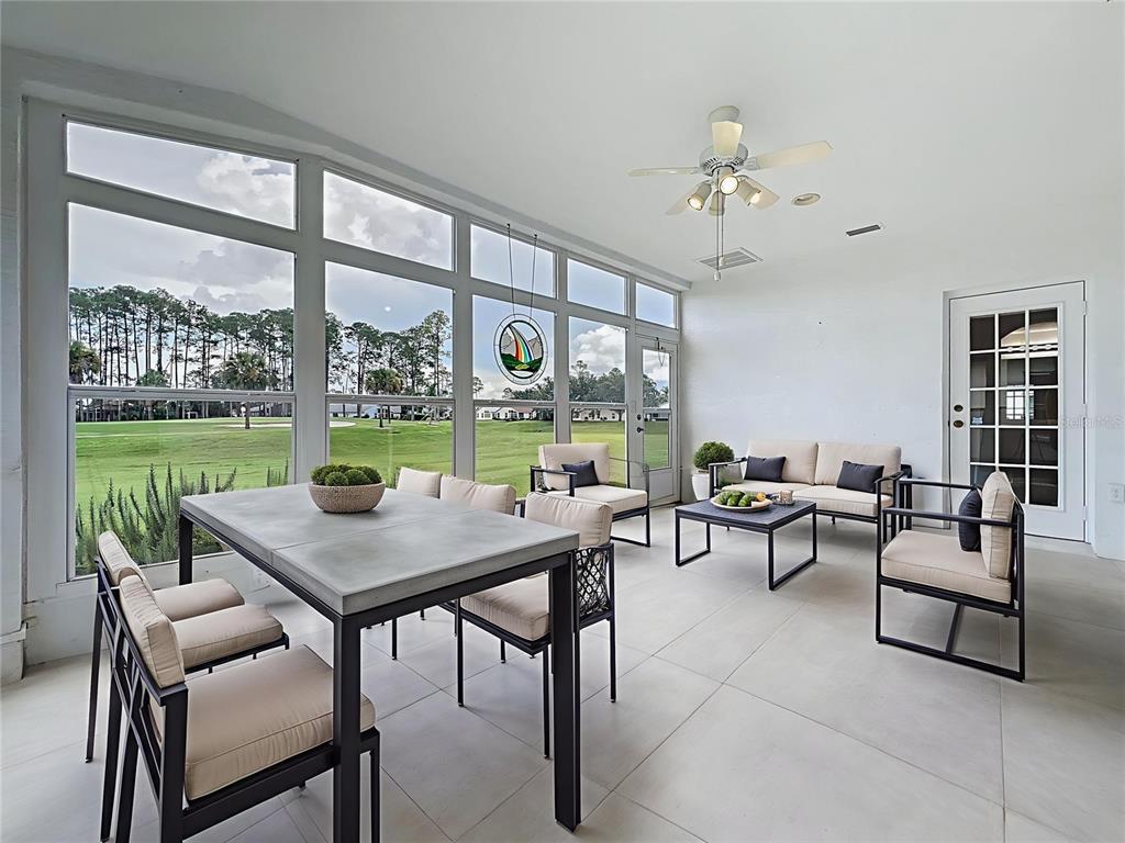 11644 Spindrift Loop Hudson, FL 34667 - Photo 72 of 99 a view of a dining room with furniture window and outside view