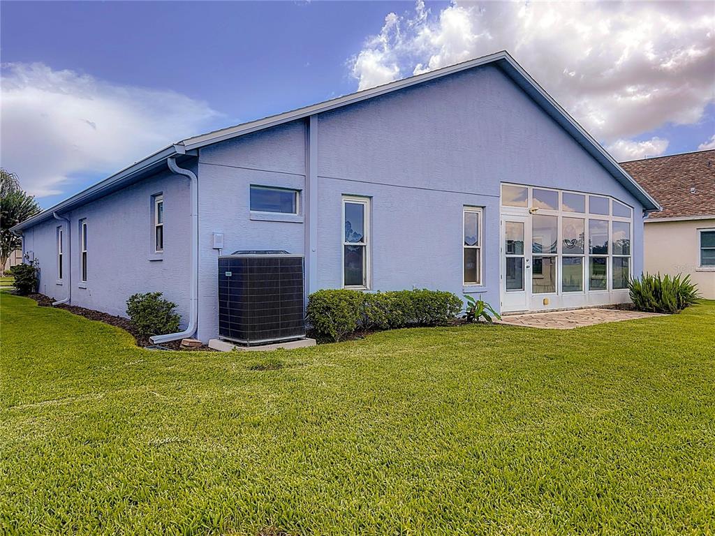 11644 Spindrift Loop Hudson, FL 34667 - Photo 74 of 99 a view of a house with backyard and garden