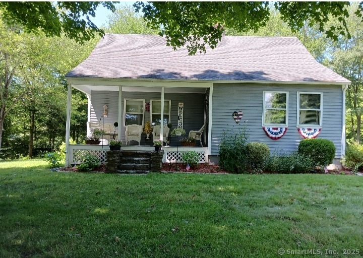 a view of a house with a garden and plants