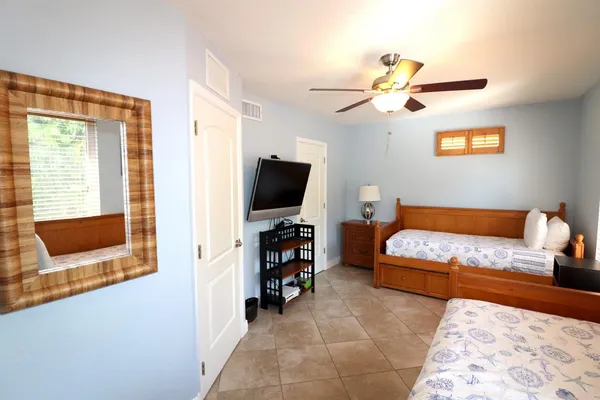 a kitchen with stainless steel appliances granite countertop white cabinets and a stove top oven