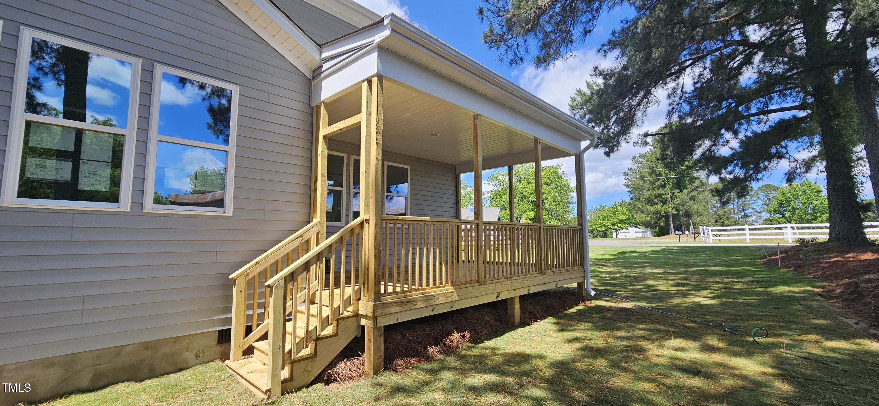 33 White Azalea Way Benson, NC 27504 - Photo 4 of 25 a view of house with a yard