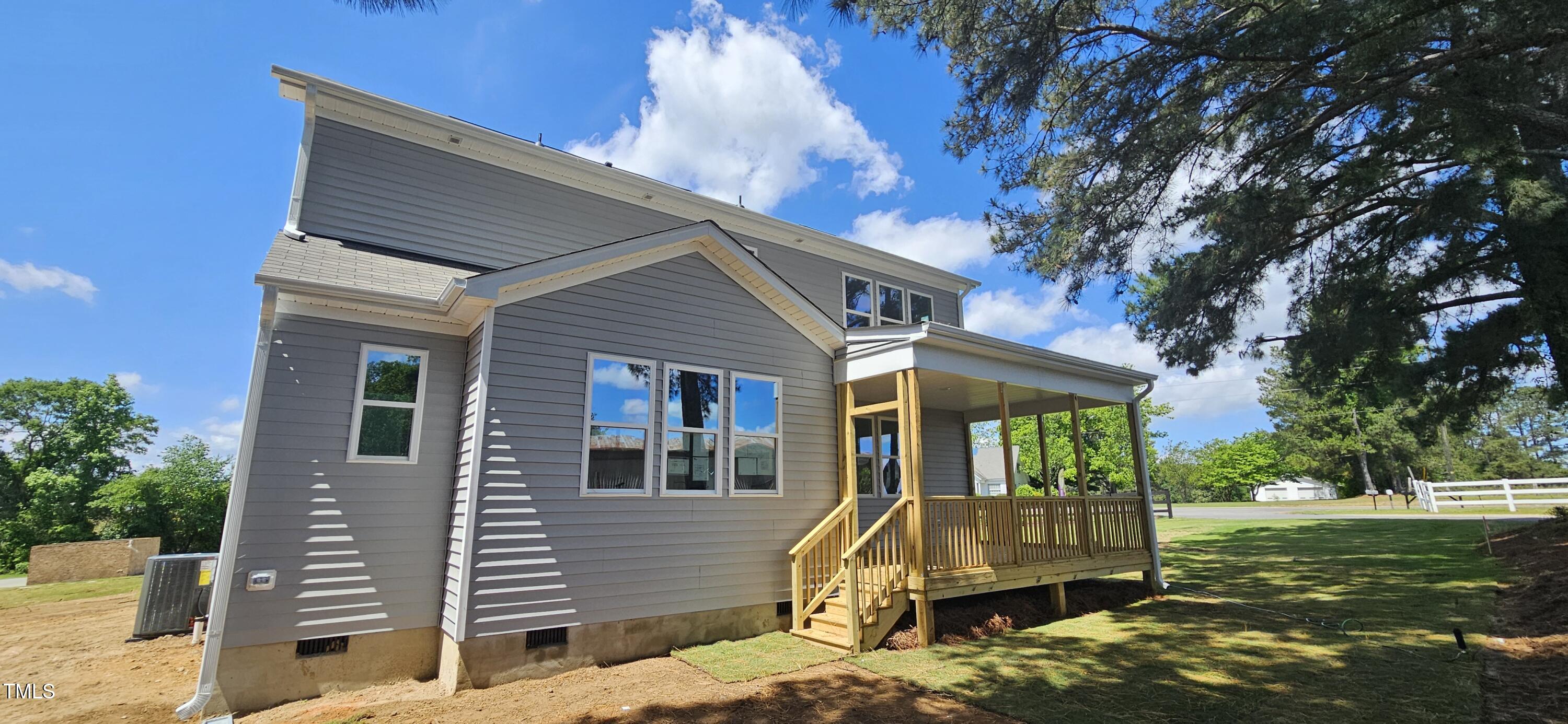 33 White Azalea Way Benson, NC 27504 - Photo 5 of 25 a view of a house with a yard