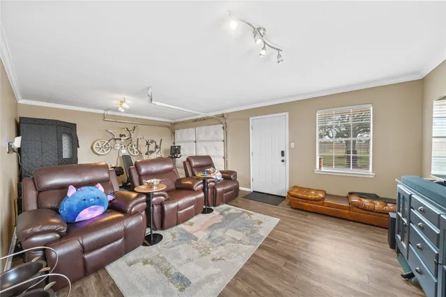 a living room with furniture window and wooden floor