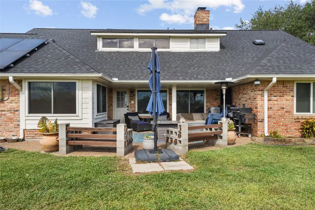 a view of the front of house with outdoor seating