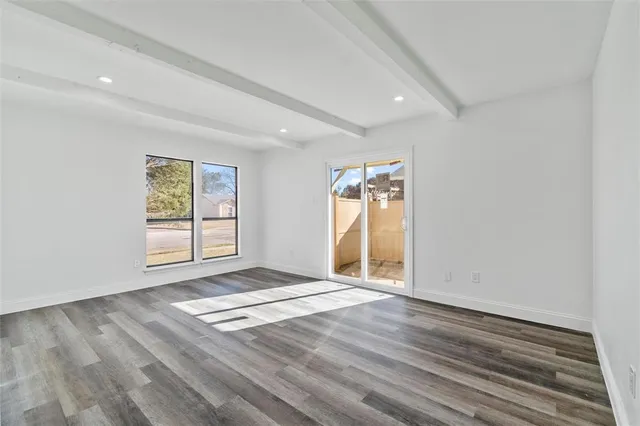 a view of an empty room and glass door
