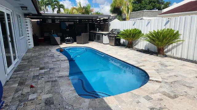 a view of a swimming pool with a patio