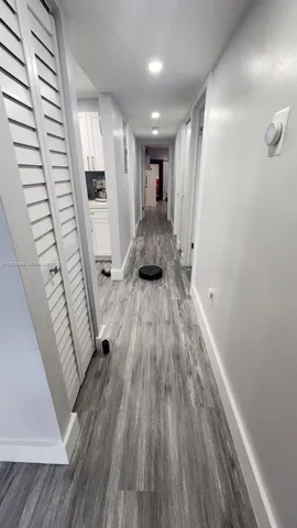 a view of entryway with wooden floor