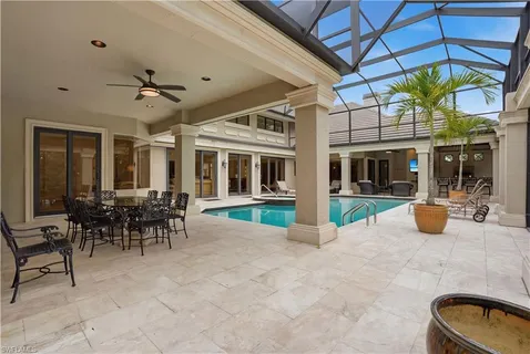 a view of a patio with chair and tables