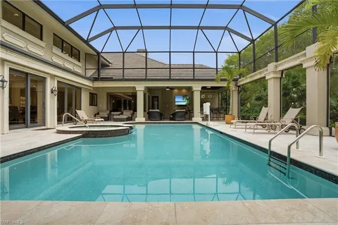 swimming pool view with a outdoor seating