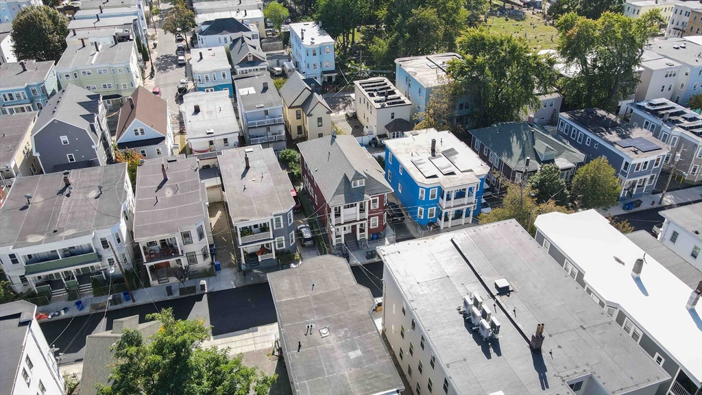 29 Cottage Street Chelsea, MA 02150 - Photo 3 of 24 an aerial view of a city with lots of residential buildings