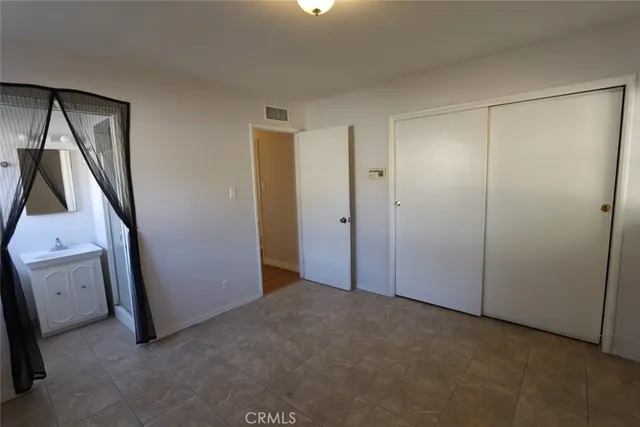 a view of room with storage and utility room