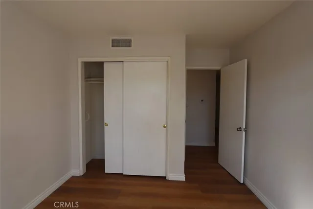 a view of a livingroom with wooden floor