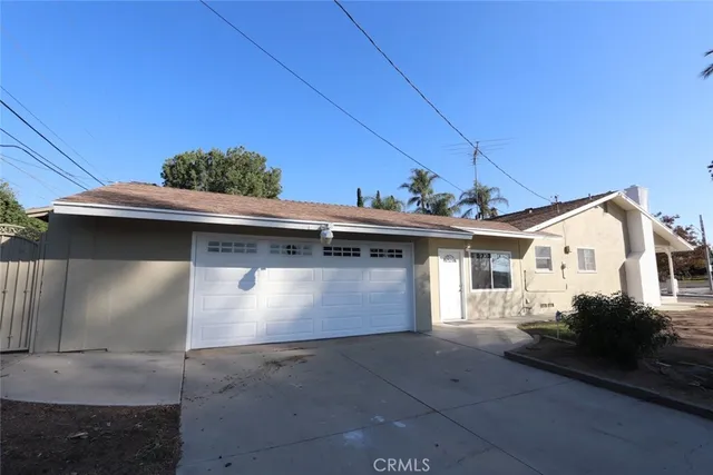 a front view of a house with a garage