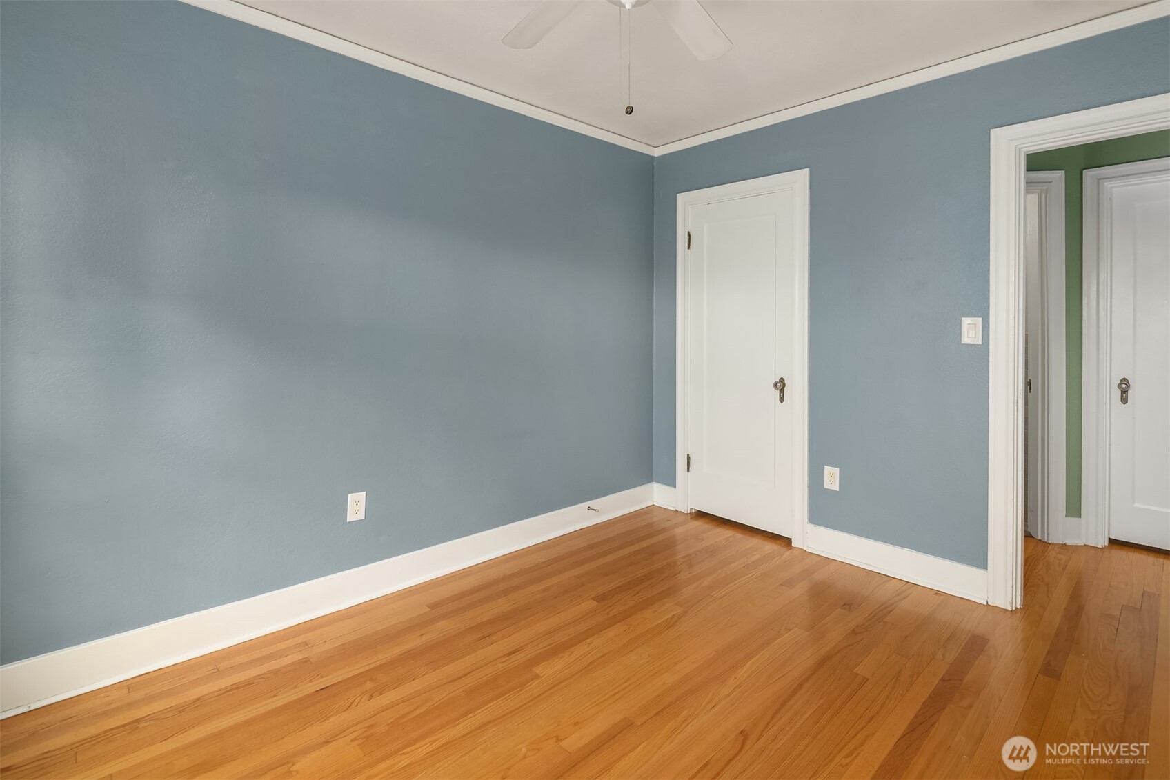 1631 16th Avenue, Unit 309 Seattle, WA 98122 - Photo 16 of 23 a view of an empty room with wooden floor