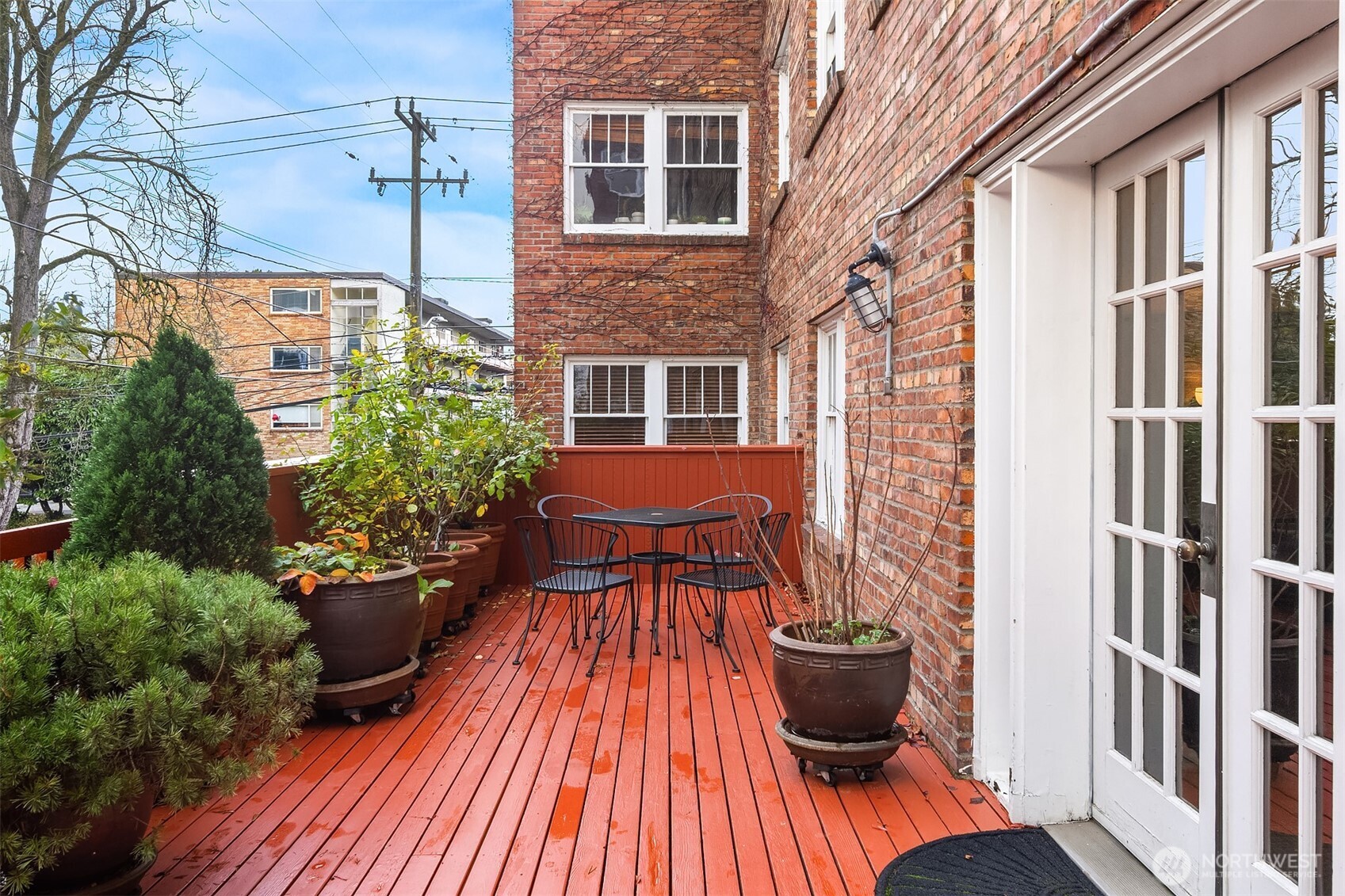 1631 16th Avenue, Unit 309 Seattle, WA 98122 - Photo 19 of 23 a view of balcony with seating space and potted plants