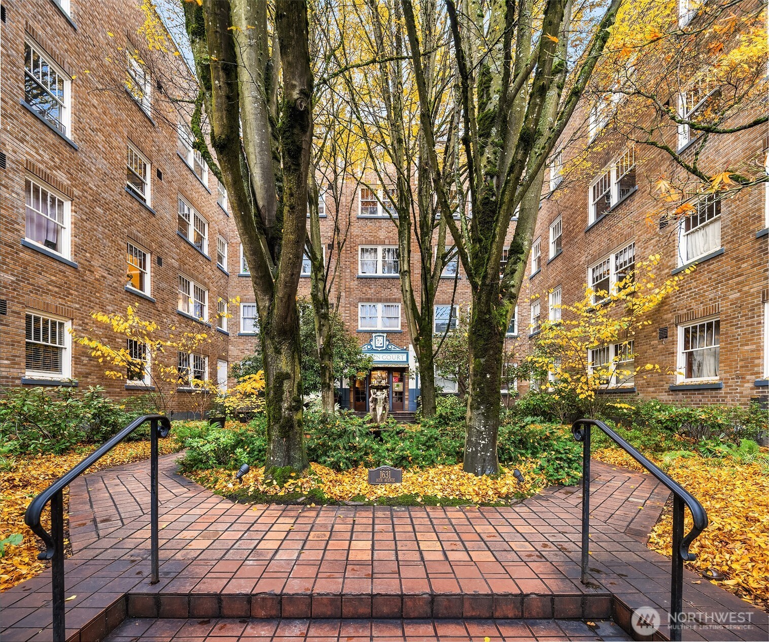1631 16th Avenue, Unit 309 Seattle, WA 98122 - Photo 2 of 23 a view of a house with brick walls