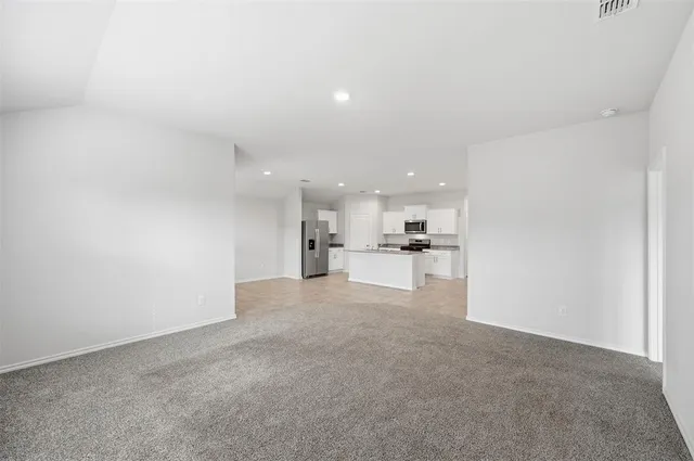 a view of a kitchen with a sink and cabinets