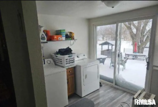 a kitchen with a refrigerator and a stove
