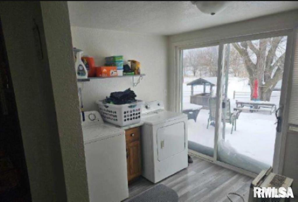 701 3rd Street Seaton, IL 61476 - Photo 9 of 10 a kitchen with a refrigerator and a stove