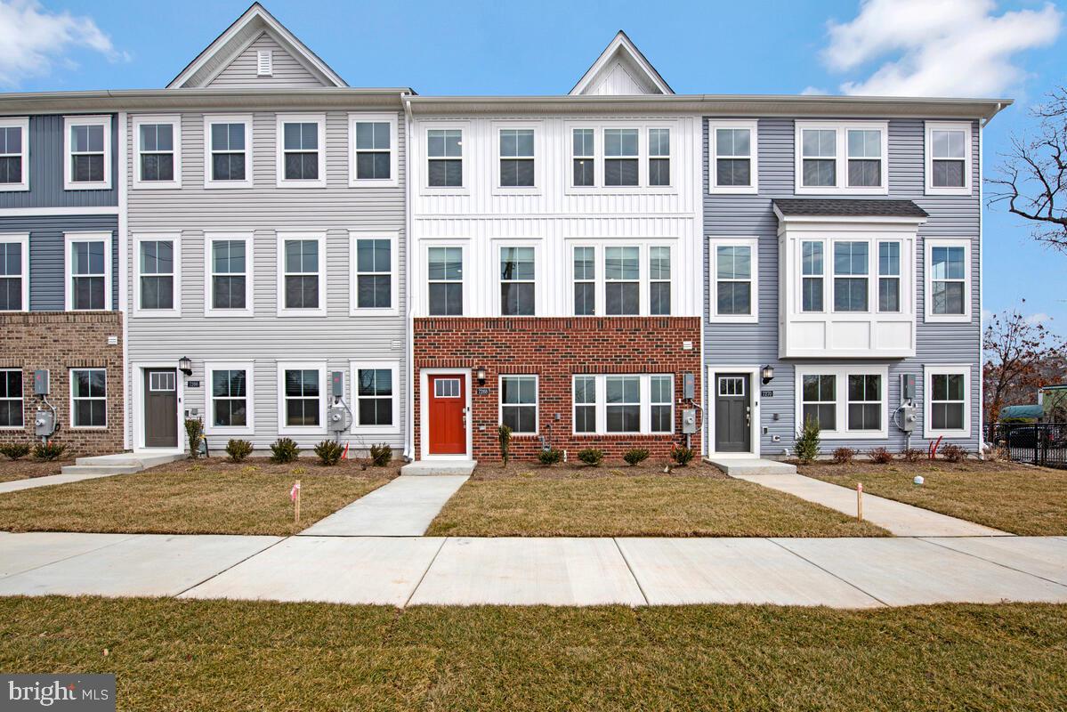 7268 Contee Road Laurel, MD 20707 - Photo 1 of 42 a front view of a building with a garden
