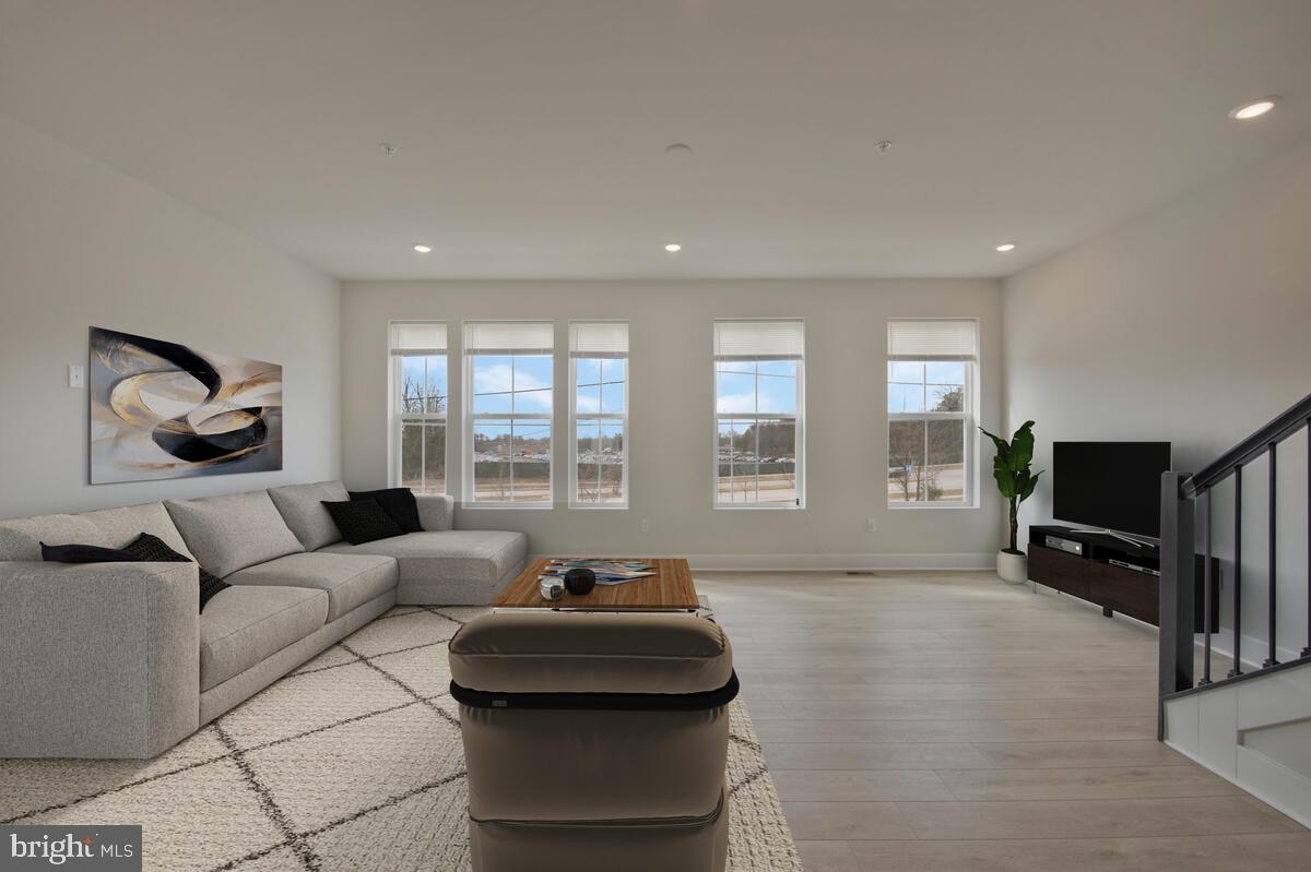 7268 Contee Road Laurel, MD 20707 - Photo 12 of 42 a living room with furniture and a flat screen tv