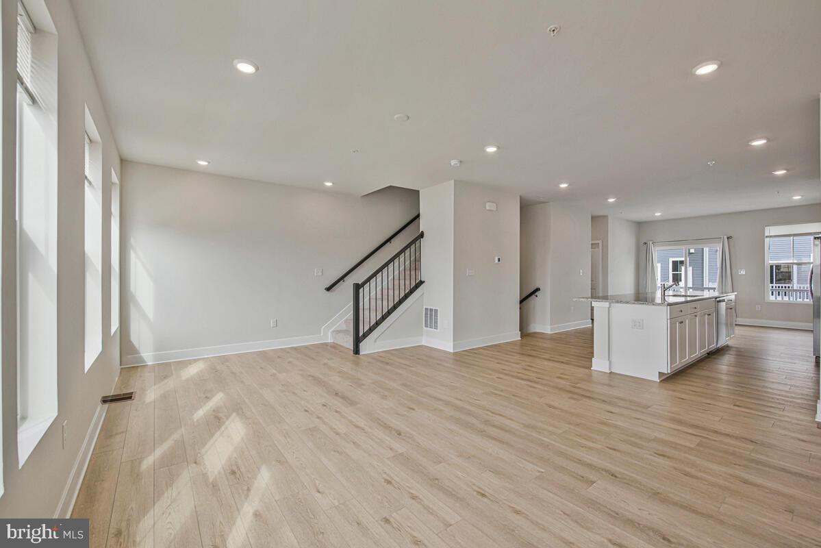 7268 Contee Road Laurel, MD 20707 - Photo 14 of 42 a view of an empty room with wooden floor and a window