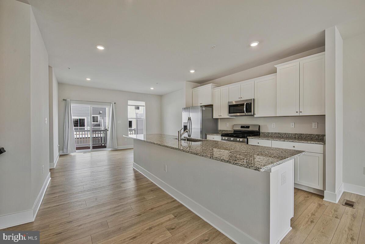 7268 Contee Road Laurel, MD 20707 - Photo 15 of 42 a large kitchen with cabinets