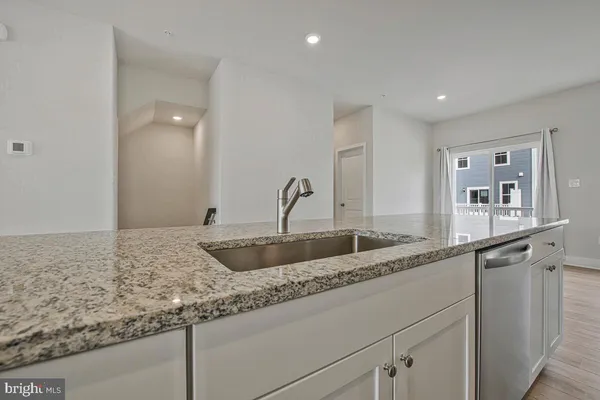 a kitchen with sink and window